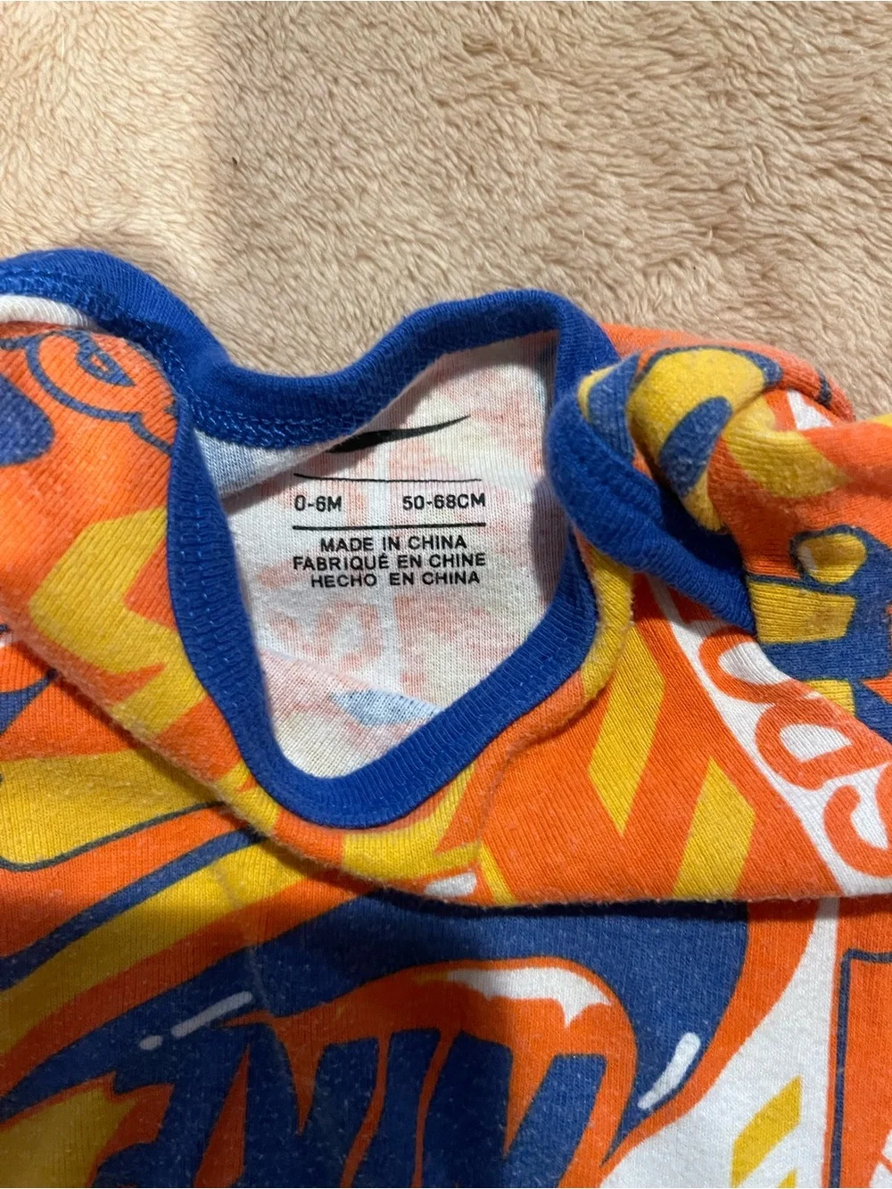 Nike Orange, Blue and Yellow 'Just Do It' Baby Bodysuit